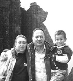 Doug Rhodes with wife, Ana Maria, and their grandson, below the 'Yogi Bear' rock formation